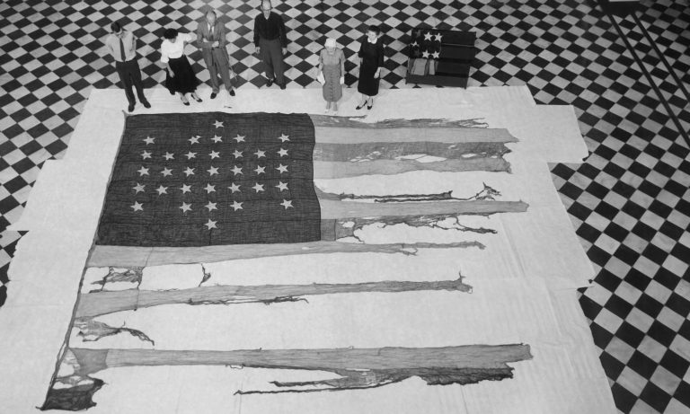 This tattered flag, shown May 7, 1958, was flying over Fort Sumter in Charleston Harbor, when Confederate troops began the War Between the States by firing on Fort Sumter. It was taken from its sealed case to be photographed by the National Park Service for a book being published on the evolution of the American flag in Charleston, S.C. File//The Post and Courier/Staff